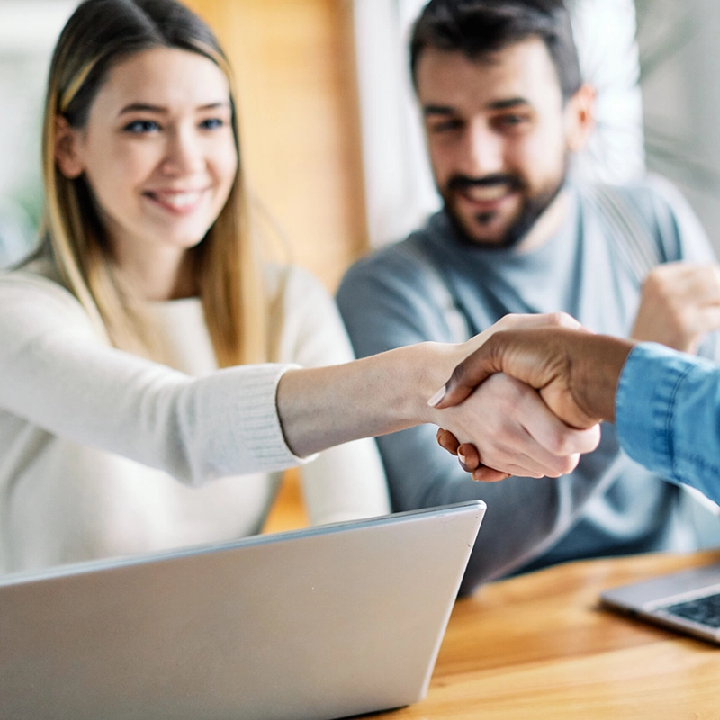 insurance-agent-square-compressed woman shaking hands